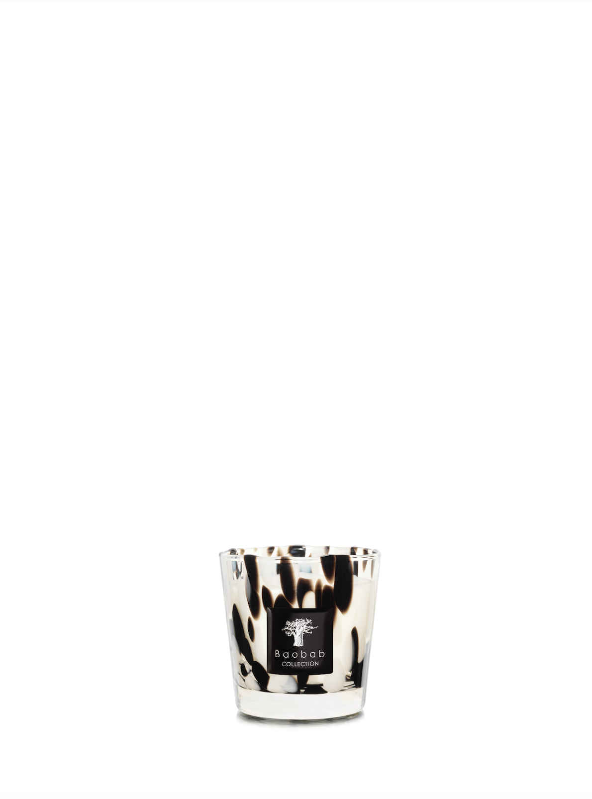 White Candle in glass vessel with black spots