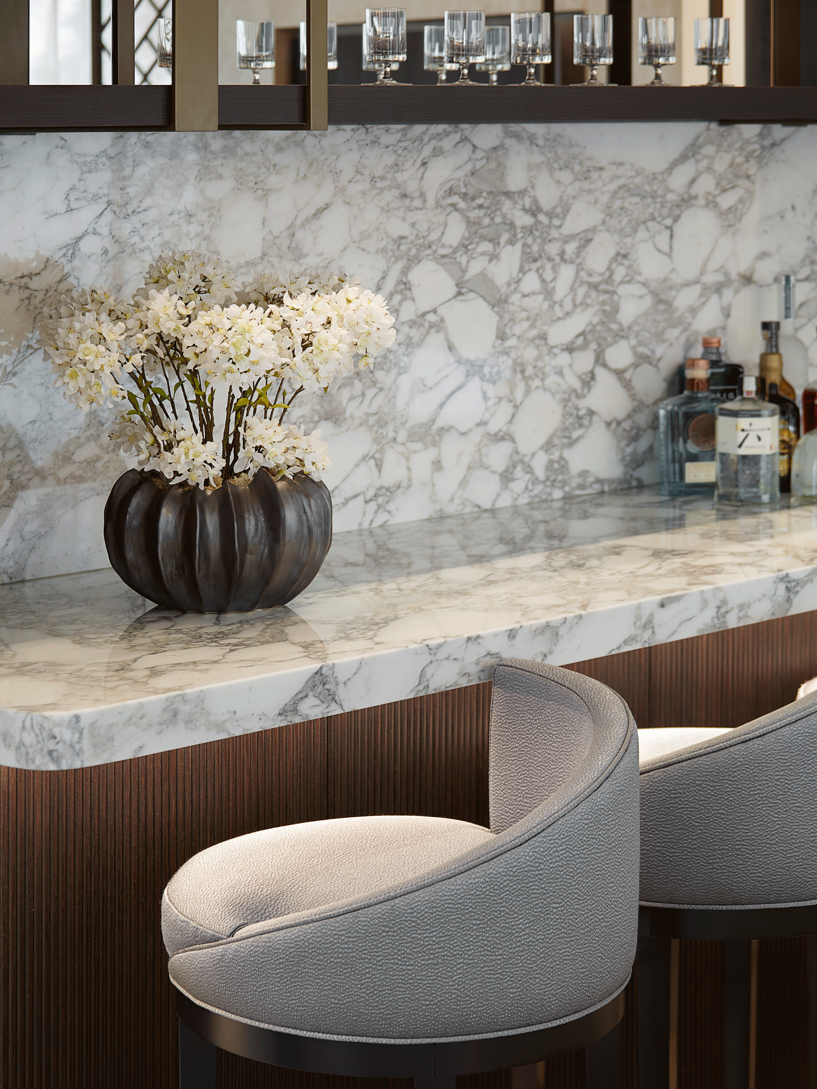 Bronze Vase with Blossom arrangement artificial set on a bar interior designed