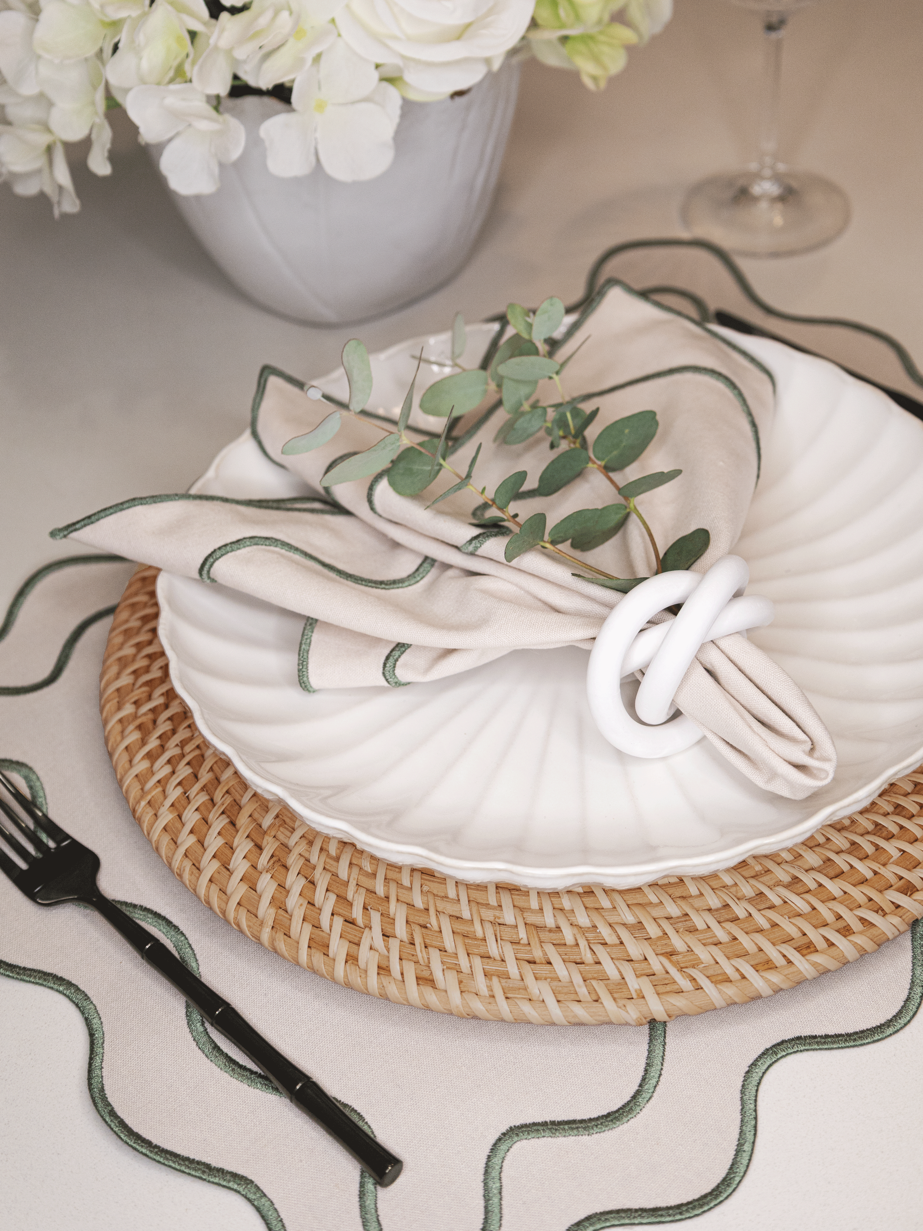 Handwoven rattan charger placemats on dining table