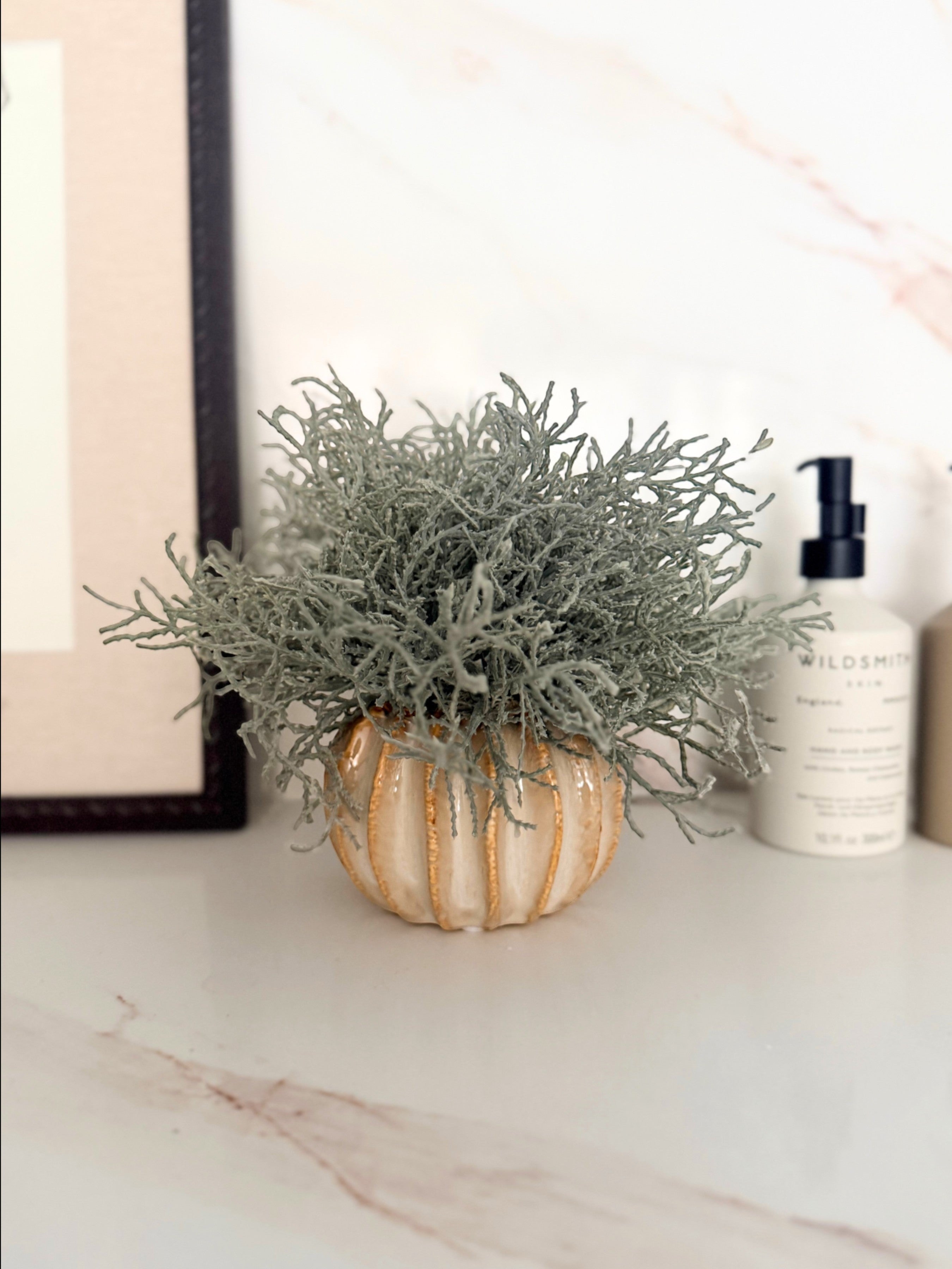 Sixty3 Styled Little Lydia ceramic vase in almond with faux Santolina greenery. Textured ribbed design.