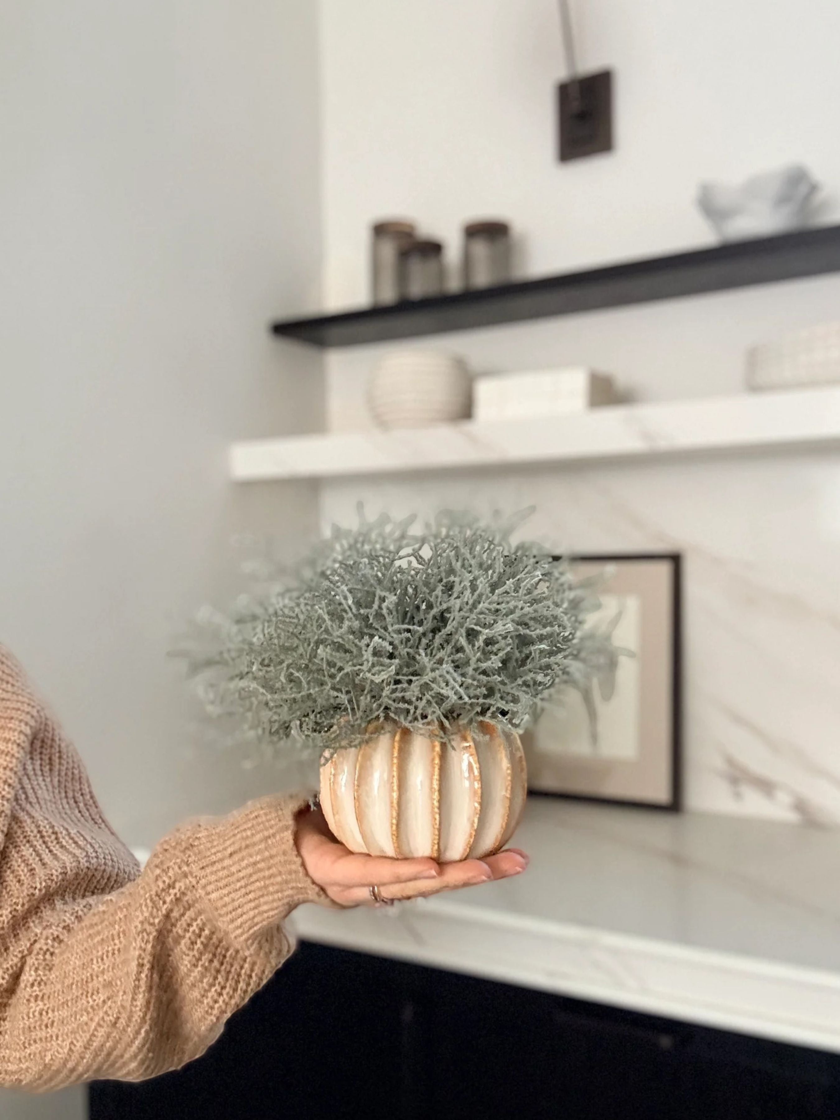 Sixty3 Styled Little Lydia ceramic vase in almond with faux Santolina greenery. Textured, ribbed design.